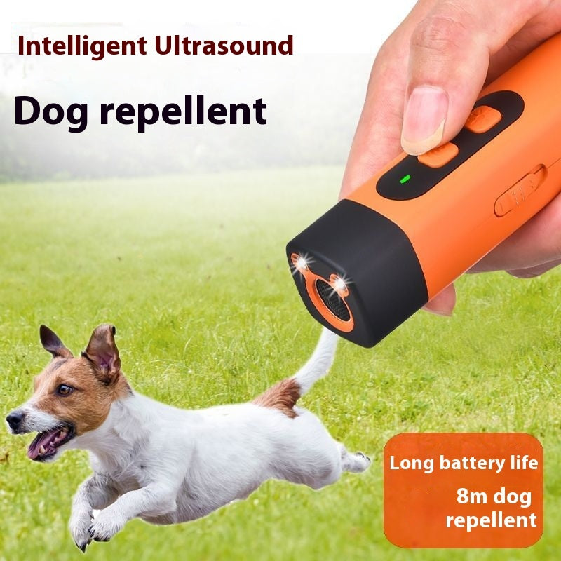 anti-bark trainer held in hand, showing compact size